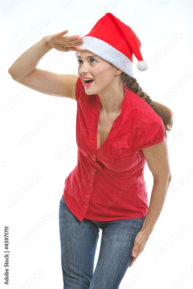 Young woman in Christmas hat looking into distance Young woman in Christmas hat looking into distance