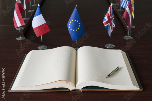 Open spread book, fountain pen, EU (European Union) (before brexit) flags