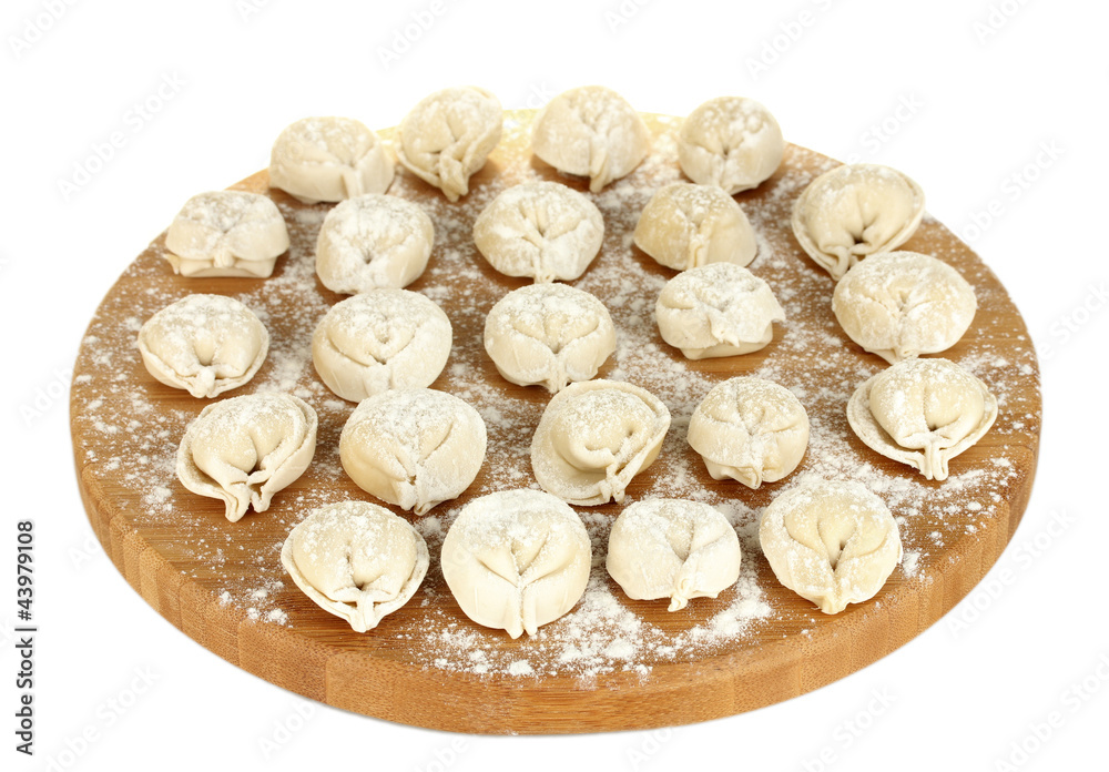Raw Dumplings on cutting board isolated on white Raw Dumplings on cutting board isolated on white