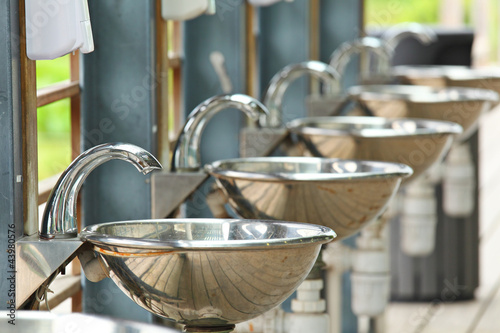 sinks and taps outdoor © leungchopan