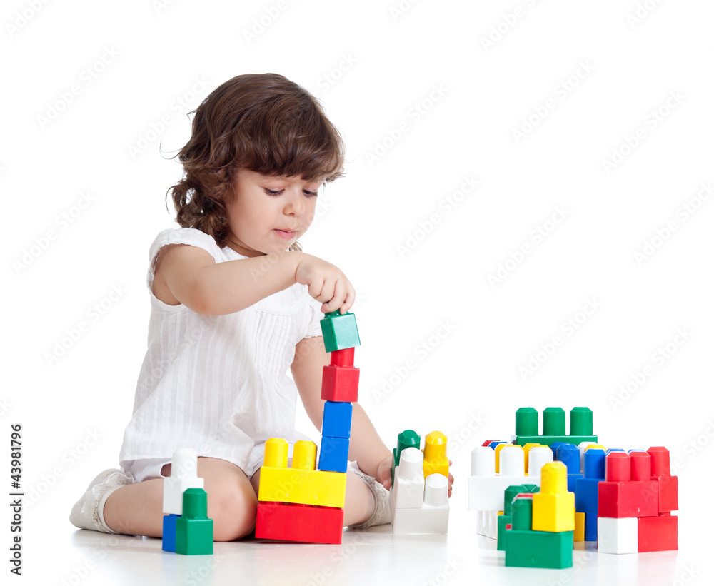 little cheerful child with construction set over white backgroun little cheerful child with construction set over white backgroun