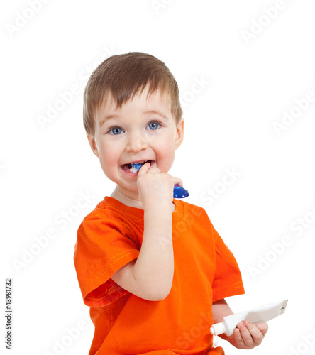 cute child brushing tooth i...