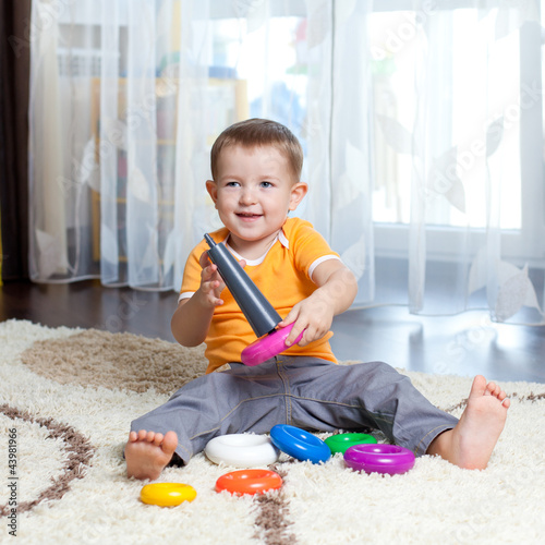 Child playing with toy at h...