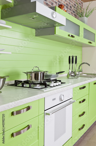 Modern kitchen interior with green decoration
