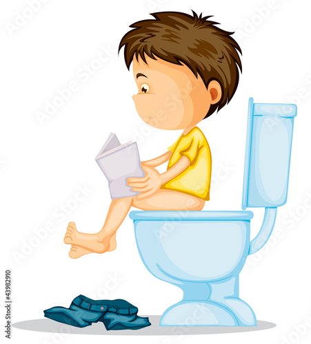 a boy sitting on commode