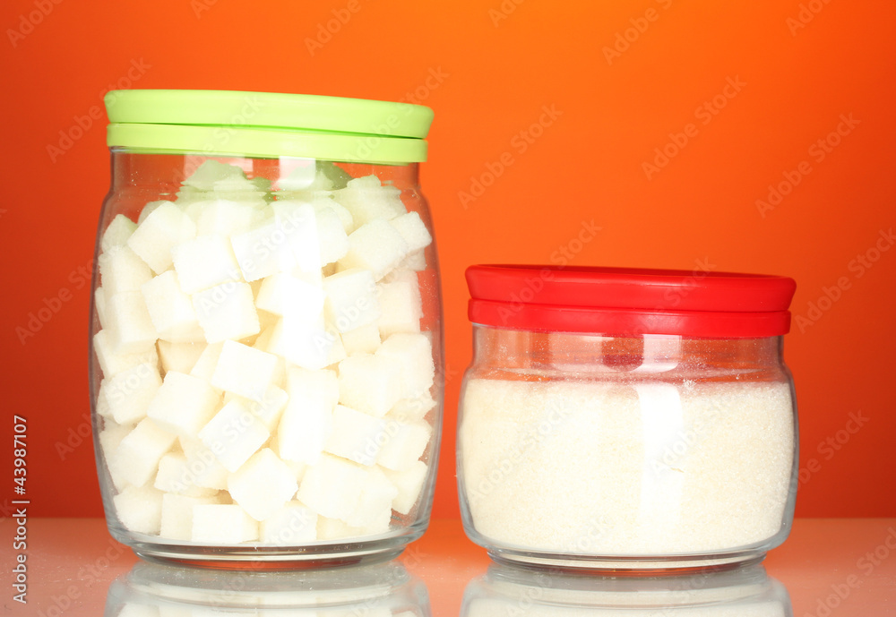 Jars with white lump sugar and white crystal sugar Jars with white lump sugar and white crystal sugar