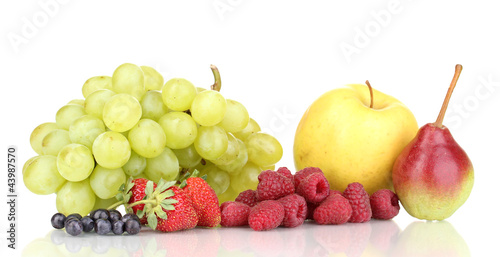 Mix of ripe sweet fruits and berries isolated on white