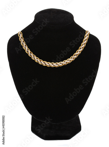 beautiful golden necklace on mannequin isolated on white