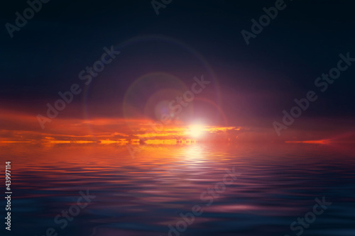 Dramatic sunset over sea with infernal clouds and dark sky © Milles Studio