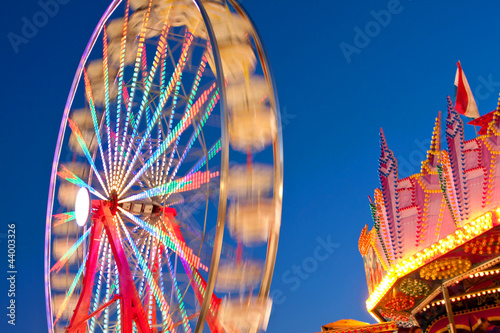 Принти на полотні Ferris Wheel Lights Blur Against Night Sky