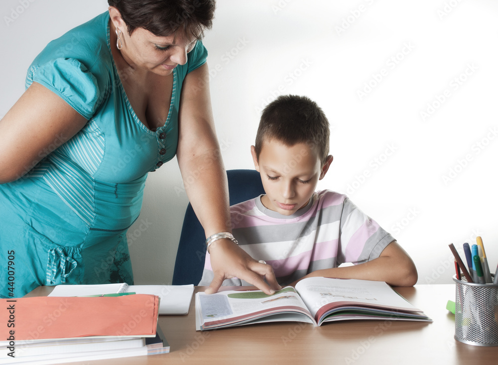 Schoolboy Studying In Classroom With Teacher Schoolboy Studying In Classroom With Teacher