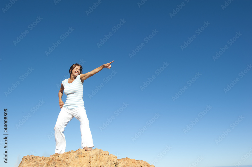Confident and successful woman on mountain top Confident and successful woman on mountain top