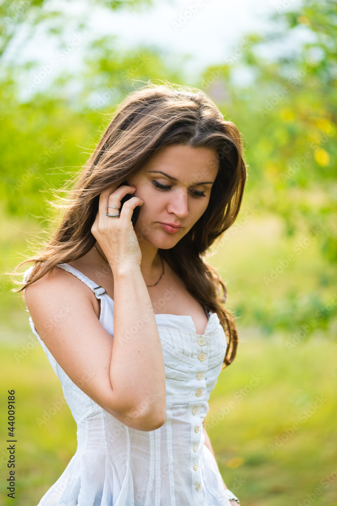 Outdoor portrait of young woman with phone Outdoor portrait of young woman with phone