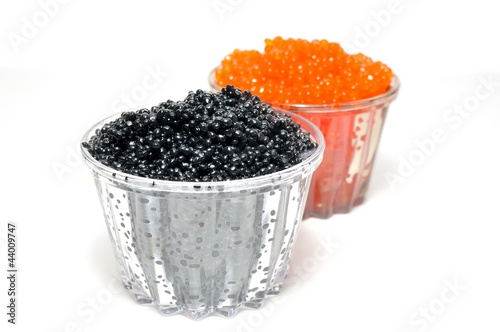 Red and black caviar in glass