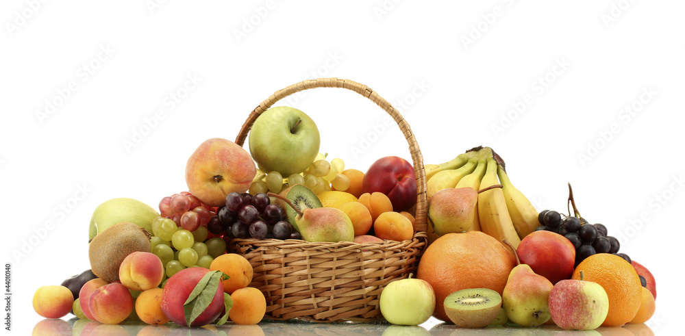 Assortment of exotic fruits in basket isolated on white Assortment of exotic fruits in basket isolated on white