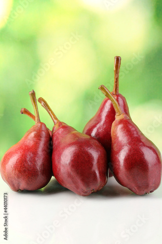 Ripe red pear on nature background