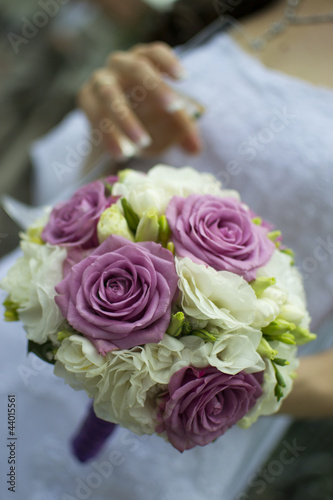 Bride holding an elegant bouquet or bunch of flowers