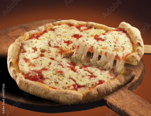 Pizza su pala di legno photo