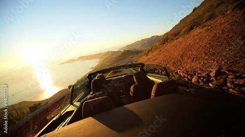 Open Top Cabriolet Driving Winding Coastal Road