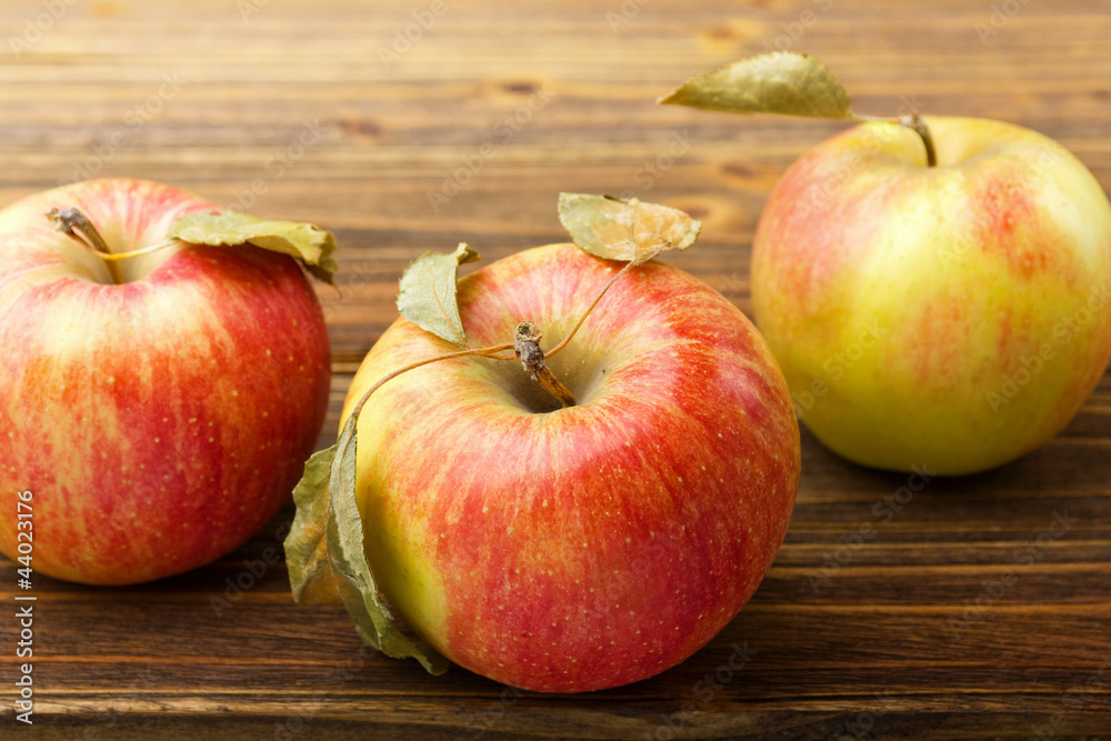 red apples on wooden table red apples on wooden table