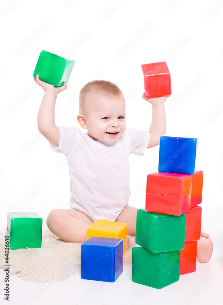Baby boy plays with toy blocks Baby boy plays with toy blocks