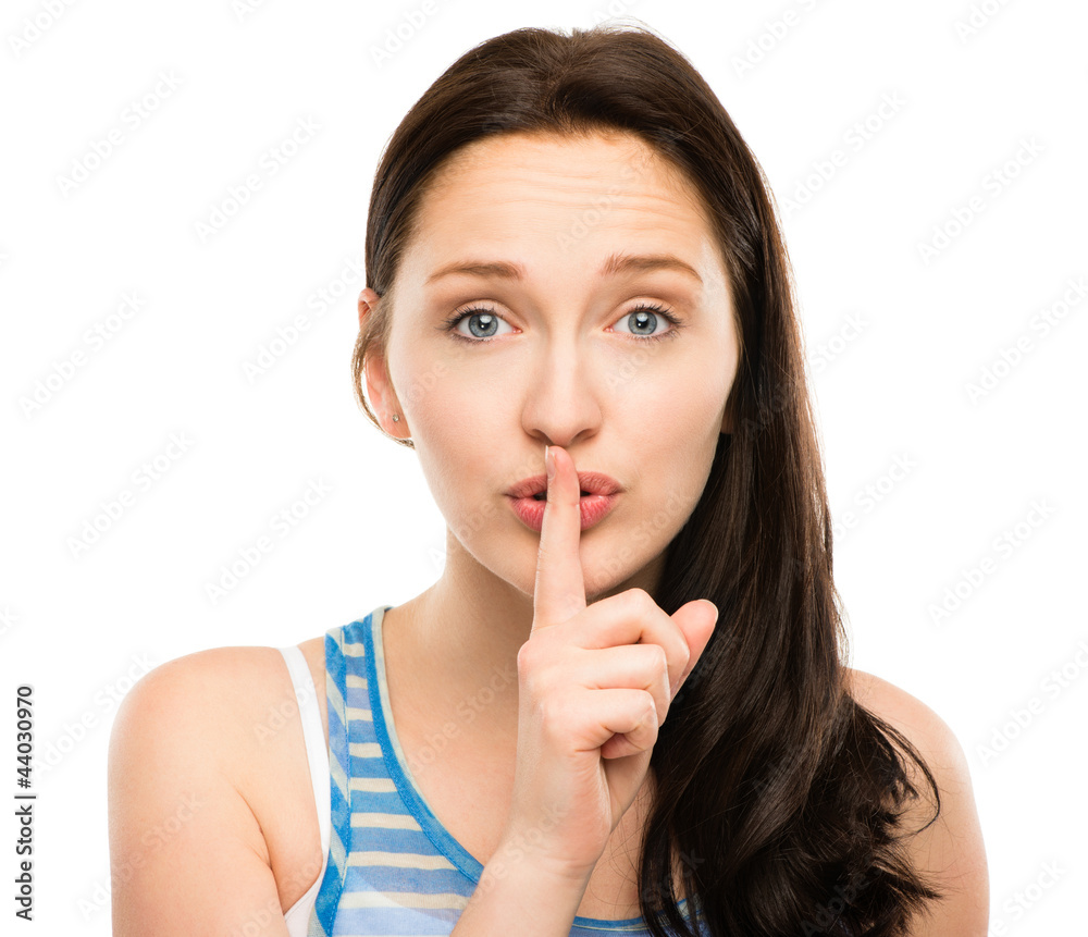 closeup portrait of woman with finger on lips pretty isolated on closeup portrait of woman with finger on lips pretty isolated on