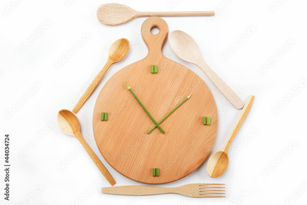 Lunch time. Meals. Watches are made of green onions on a wooden Lunch time. Meals. Watches are made of green onions on a wooden