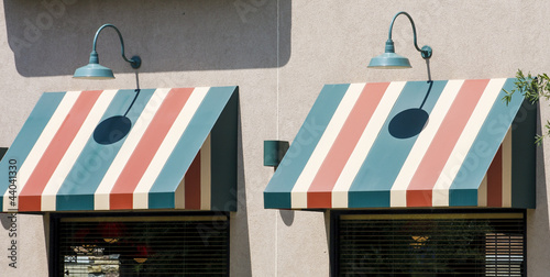 Green Lamps Over Striped Awnings photo