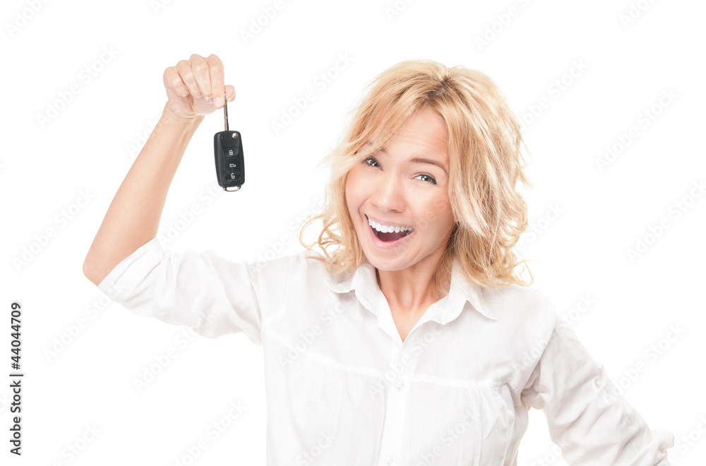 Happy young woman with car key on white. Happy young woman with car key on white.