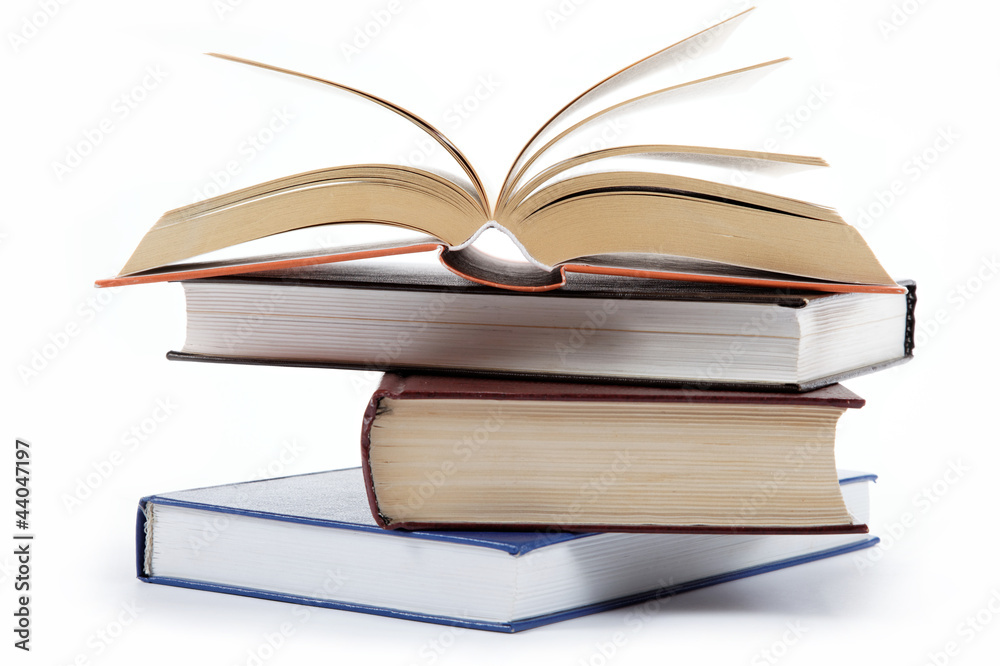 A stack of books on a white background. A stack of books on a white background.