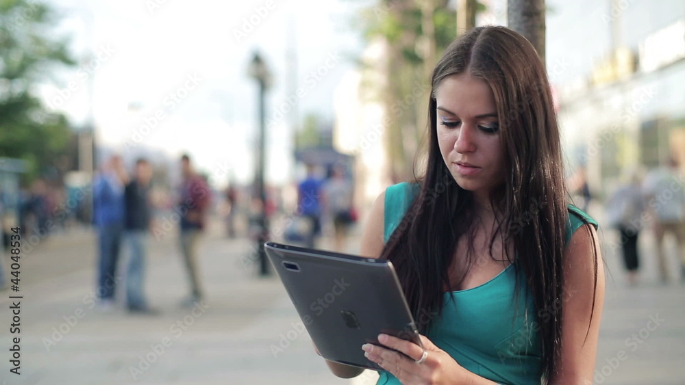 Happy young woman with tablet computer in the city Happy young woman with tablet computer in the city