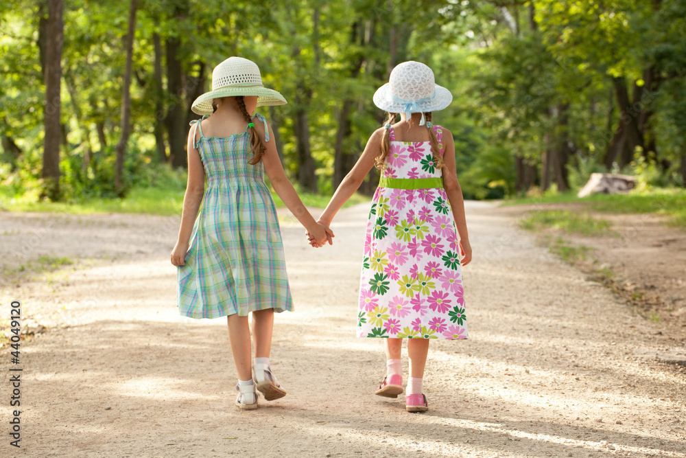 Two girls go hand in hand Two girls go hand in hand