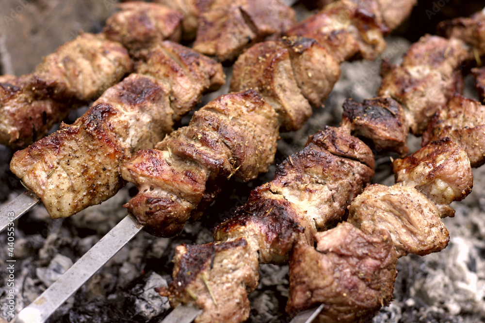 Insanely delicious kebab prepares on the fire outdoors Insanely delicious kebab prepares on the fire outdoors