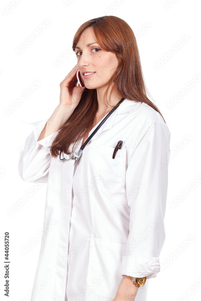 female doctor standing and speaking on the phone female doctor standing and speaking on the phone