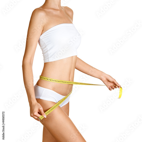 Woman measuring her waistline. Perfect Slim Body. Diet