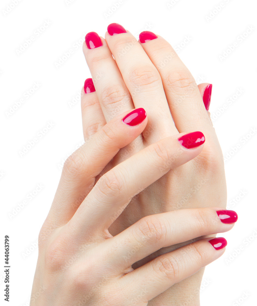 Beautiful Female Hands red manicure shellac near face Beautiful Female Hands red manicure shellac near face