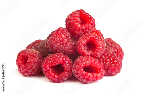 Group of some raspberries on a white background. Close up macro