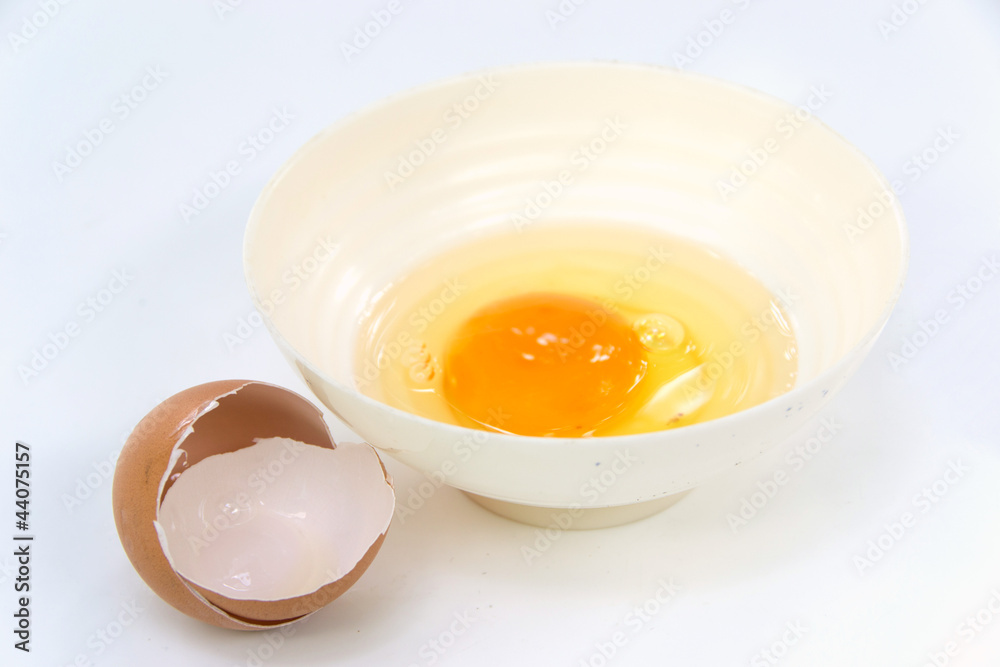egg yolk in a bowl for cooking and egg shell egg yolk in a bowl for cooking and egg shell