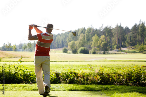 Man playing golf