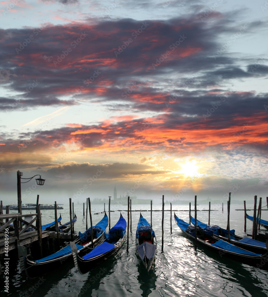 Gondolas against beautiful sunset in Venice, Italy