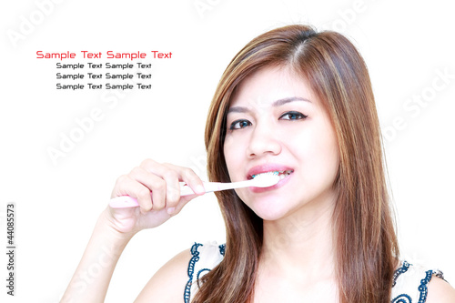 Wallpaper Mural Young Asian Woman smiling and brushing her teeth Torontodigital.ca