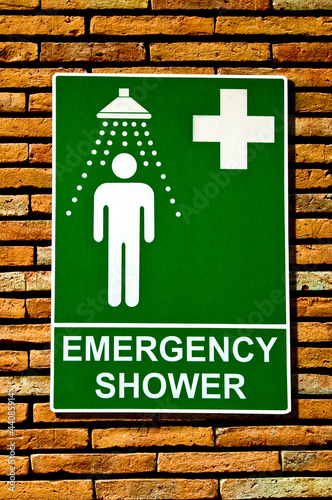 The Sign emergency safety shower on wall background