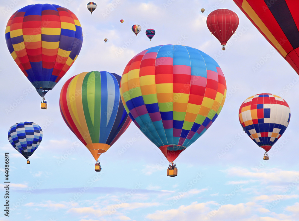 Multicolored hot air balloons flying