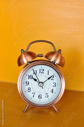 alarm clock and orange background