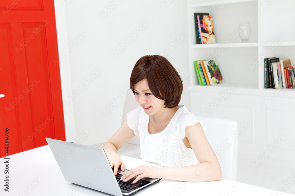Beautiful young business woman using a laptop computer. Portrait Beautiful young business woman using a laptop computer. Portrait