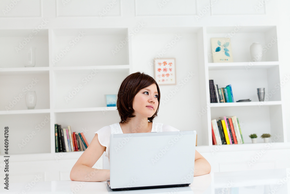 Beautiful young business woman using a laptop computer. Portrait Beautiful young business woman using a laptop computer. Portrait