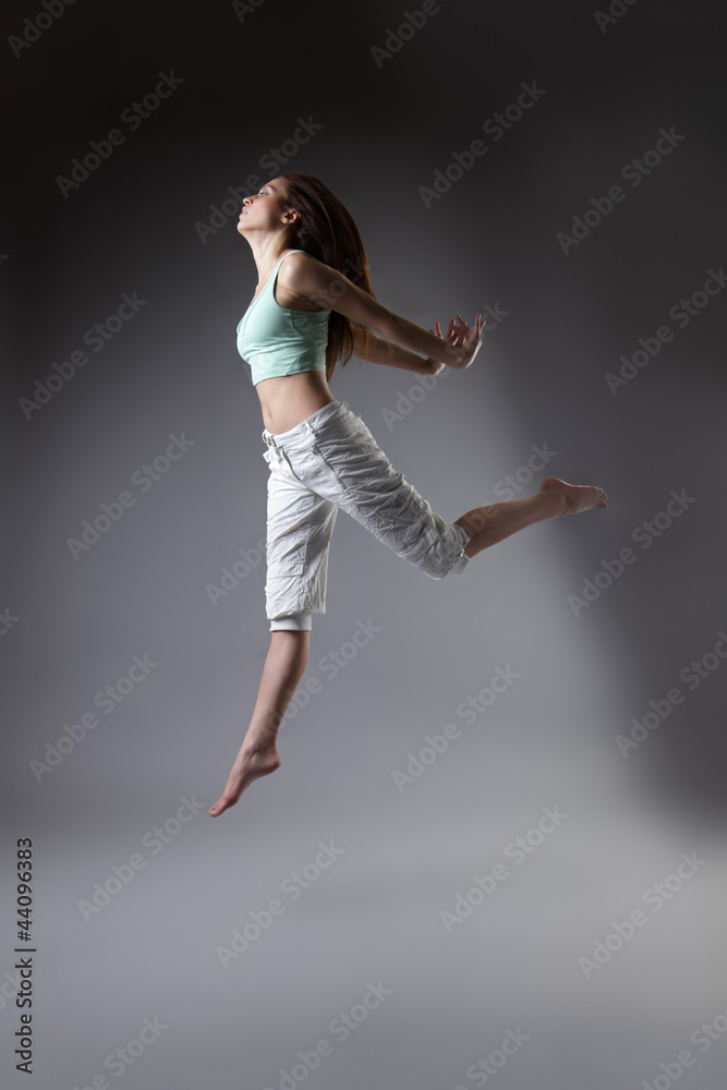 beauty girl dance on grey background