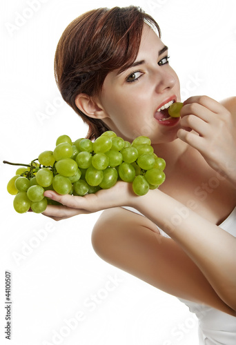 young girl eating a grape wine isolated on white background