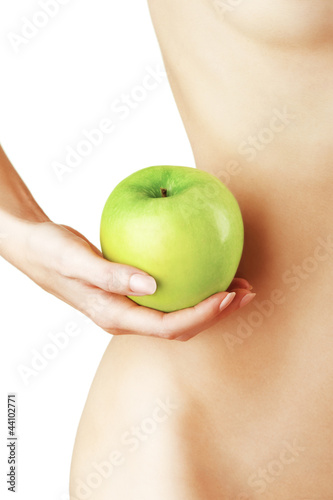 Beautiful woman body and green apple