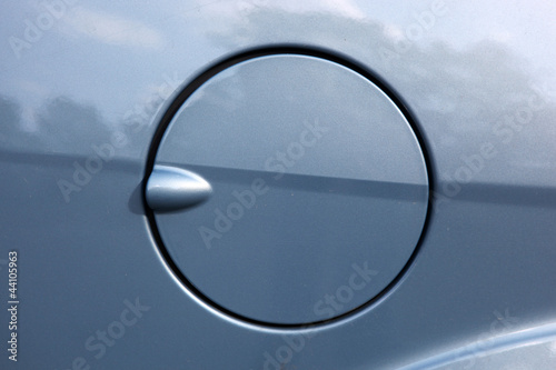 A close up of a petrol cap cover on a modern car. photo